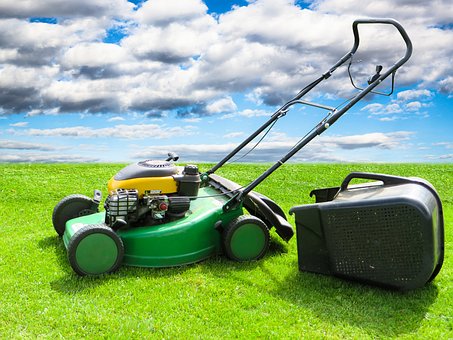 Grass cutting services. Mowing and lawn care and maintenance. Lawn mower.